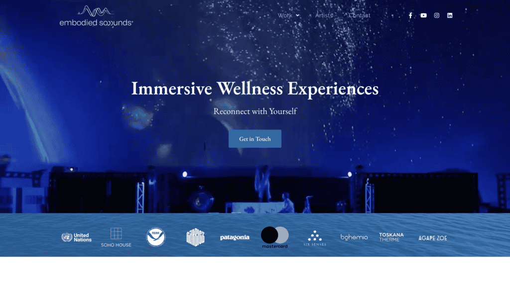 Stage with blue lighting and confetti for immersive wellness event.