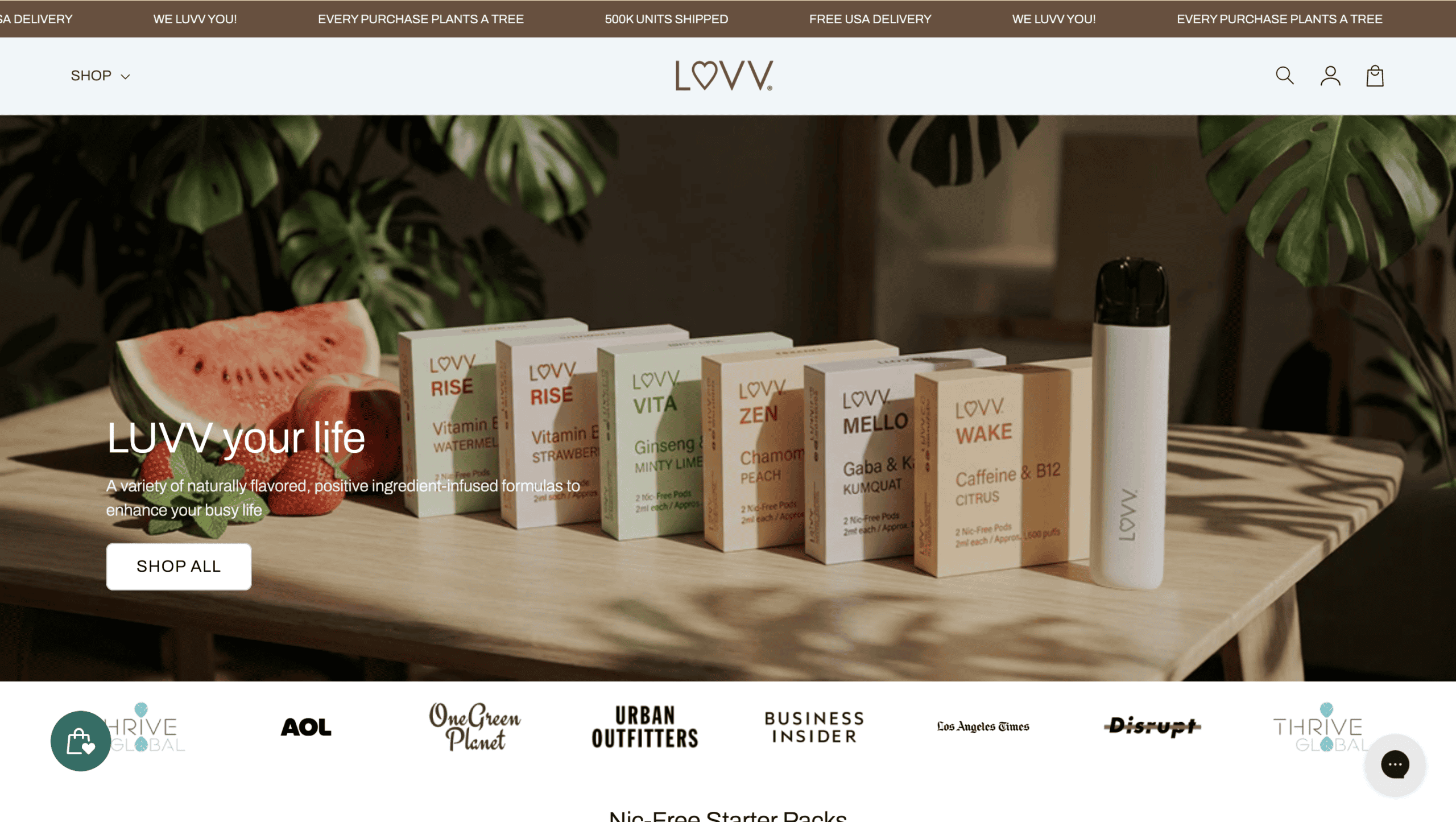 LUVV Labs wellness products on a wooden table with green plants.
